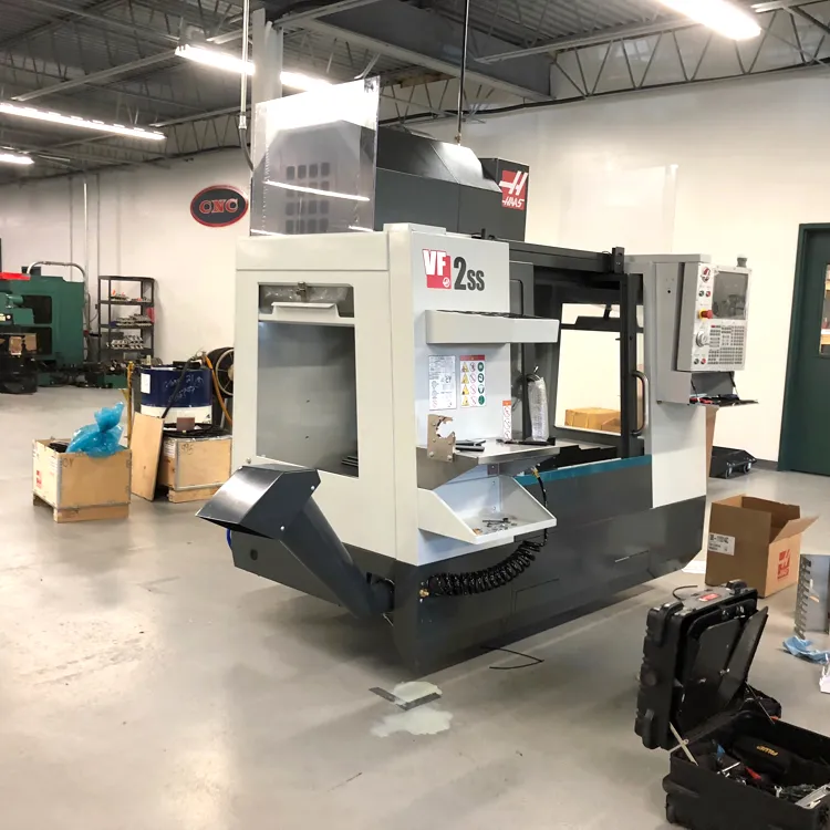 One of the shop’s two Haas VF-2SS machining centers being uncrated on arrival