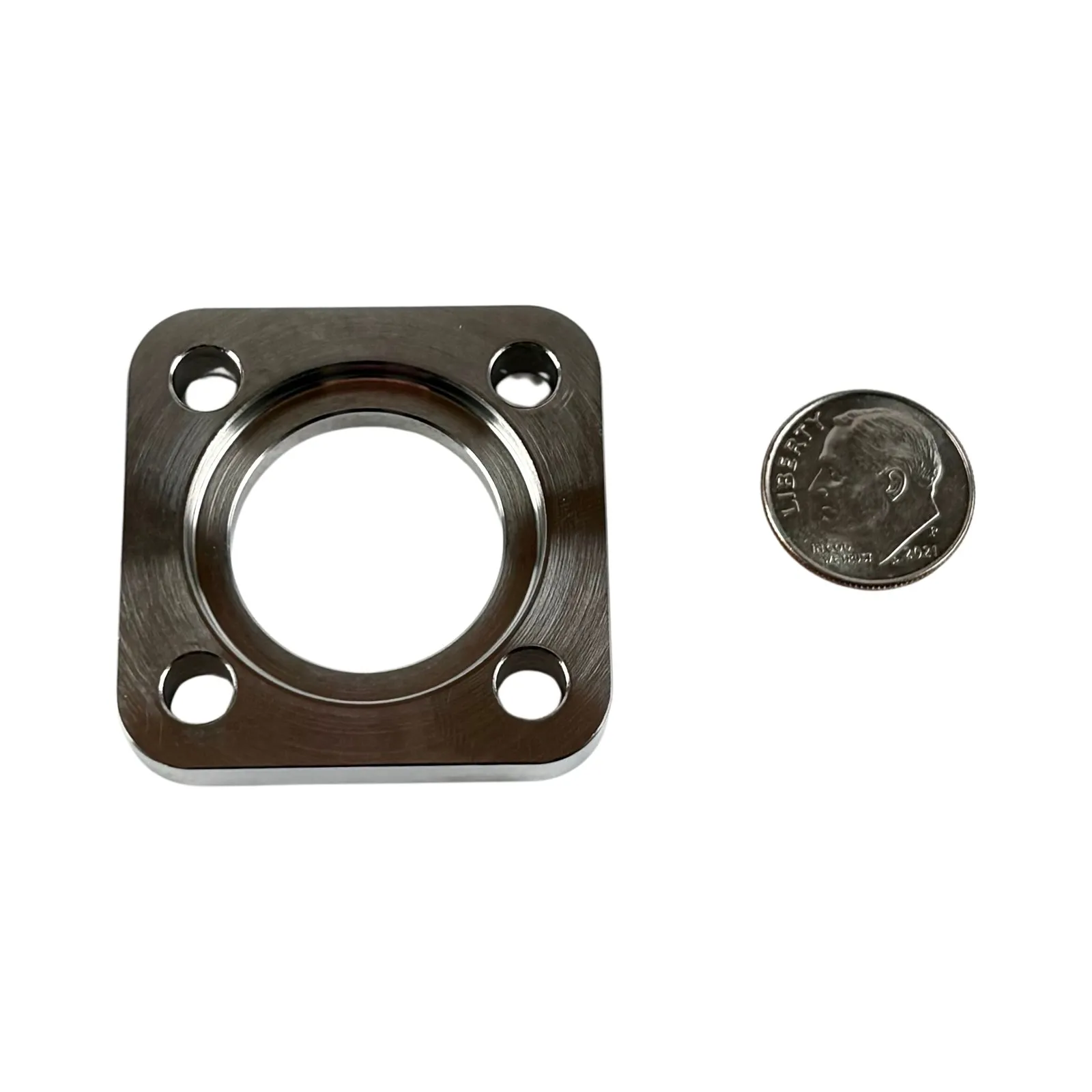 A machined stainless steel square mounting flange with a central bore and four corner mounting holes