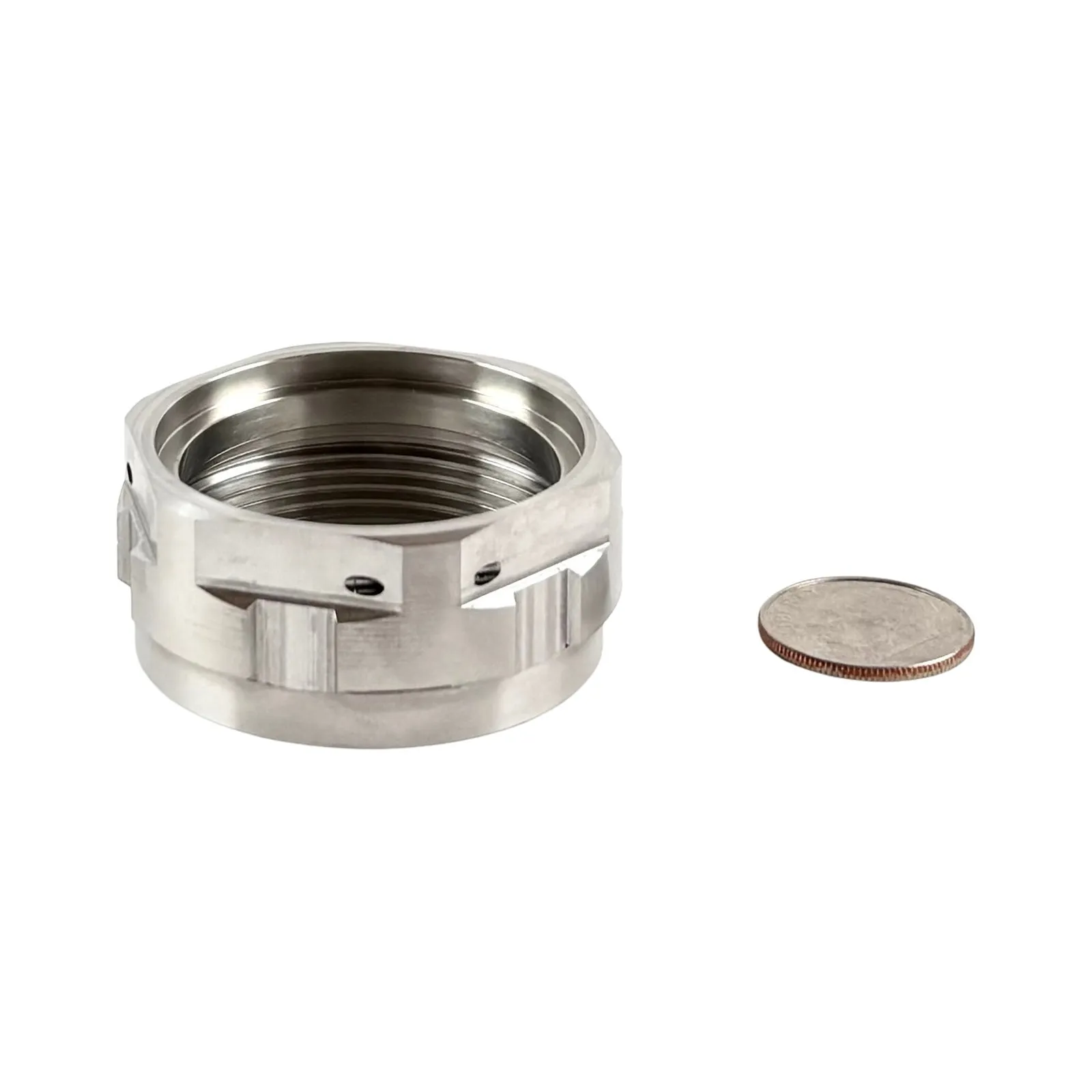 An internally threaded stainless steel collar with milled wrench flats, cross slots, and small radial holes