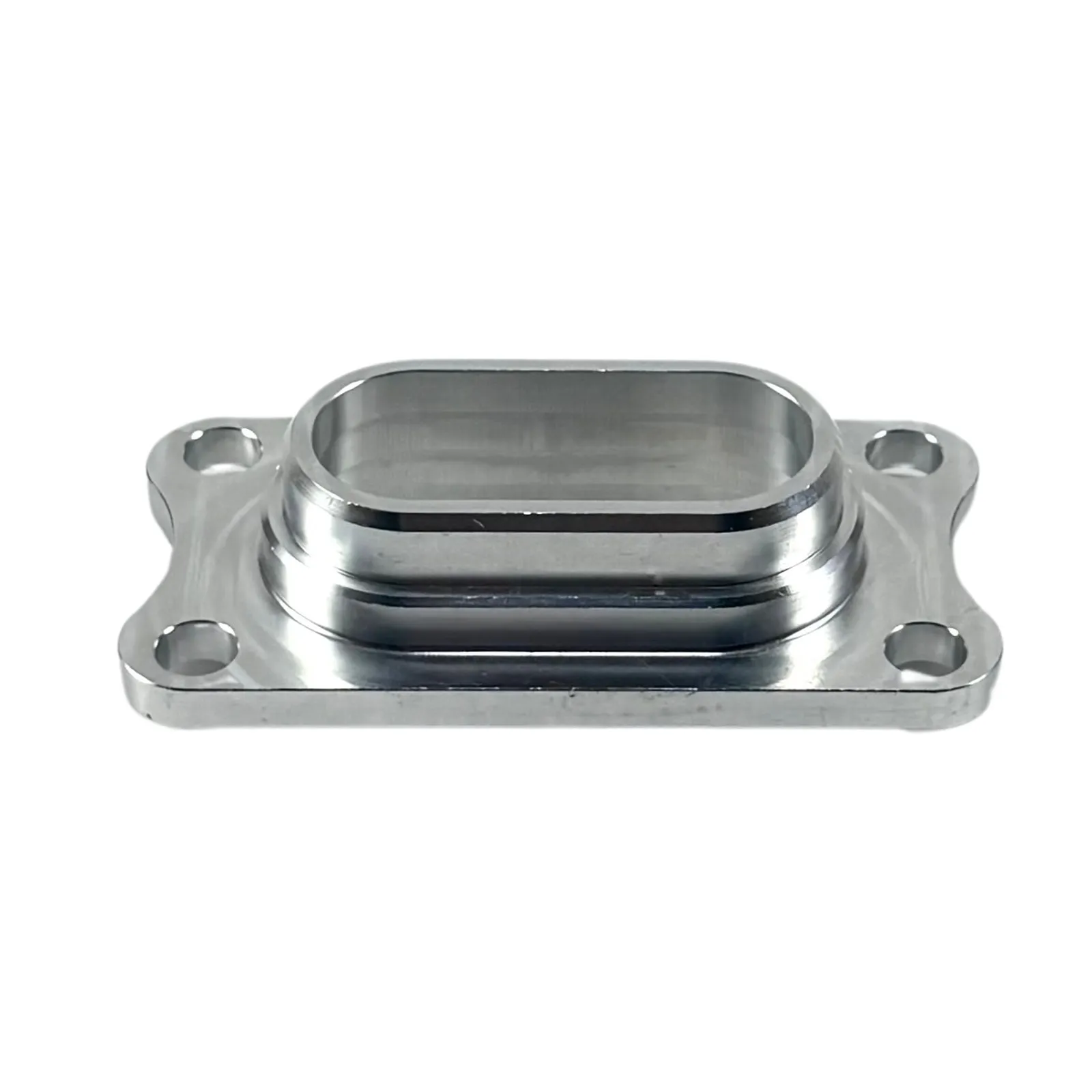 A polished aluminum flange adapter with a raised oblong boss and four corner mounting holes