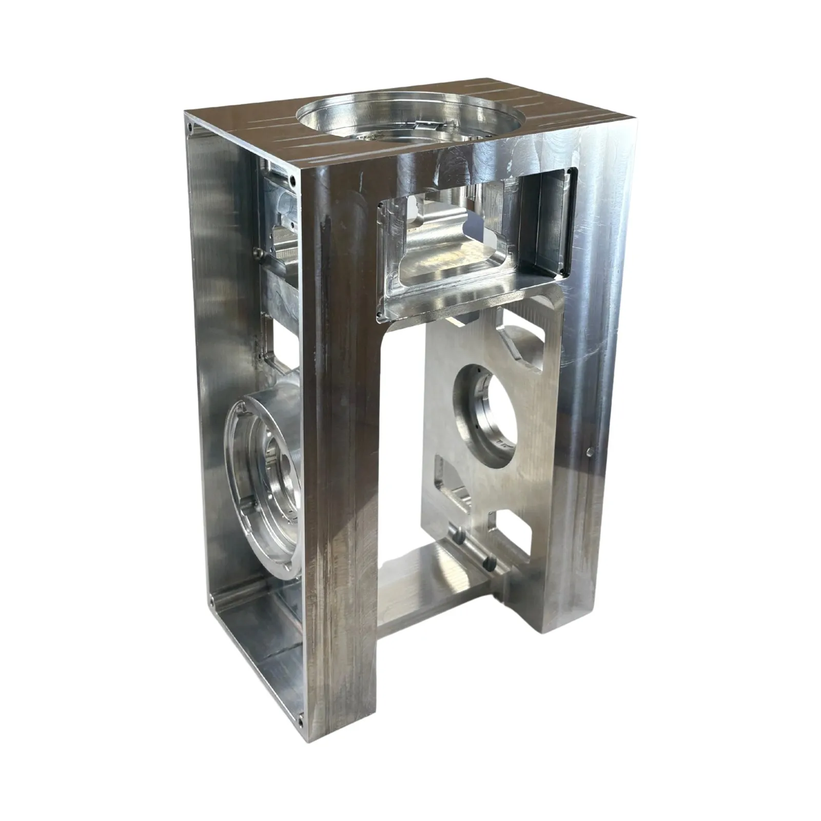 A tall open-frame milled aluminum housing with bored circular bosses and milled pockets — multi-feature prismatic machining