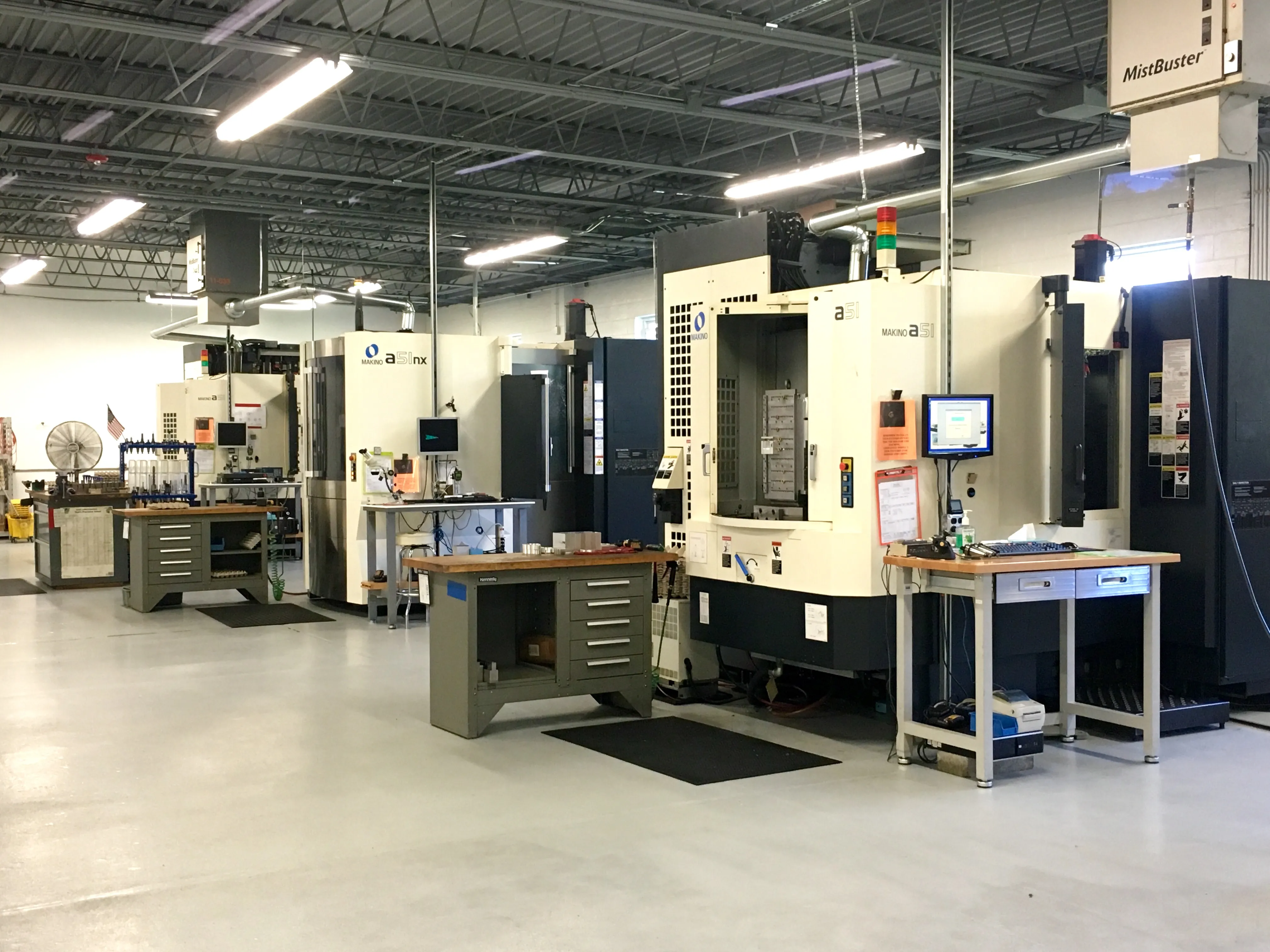 Setup benches alongside the Makino A51 horizontal machining cells — four run with pallet automation